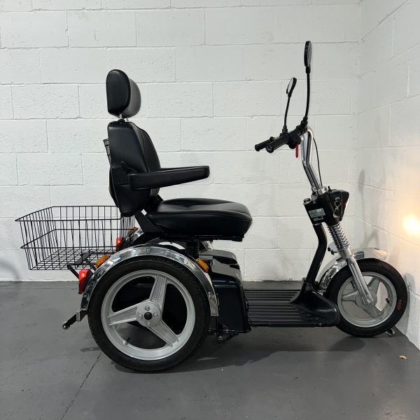 3 wheeled lack scooter with chrome mud guards and pilot seat side profile