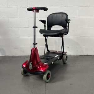 cherry red 4 wheeled scooter with black leather swivel seat and adjustable tiller